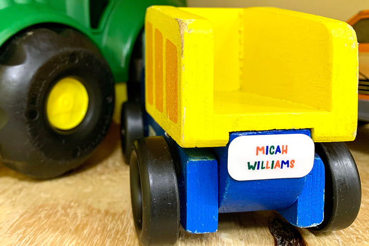 Vinyl identification sticker on a child's toy truck: Personalized label with child's name and contact information, adding a touch of customization and ownership to the toy truck.